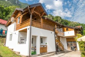 a house in the mountains with a wooden roof at na obali drine in Perućac