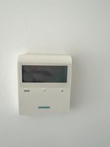 a sony strazen computer monitor on a wall at Modern Sea View Apartment - Arkitsa Rentals in Arkitsa
