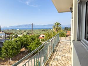 a balcony with a view of the ocean at Modern Sea View Apartment - Arkitsa Rentals in Arkitsa