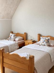a bedroom with two beds and two night stands at Gorštak in Žabljak