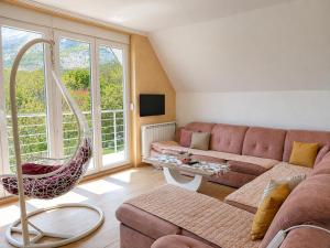 a living room with a couch and a table at Gorštak in Žabljak