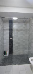 a bathroom with a glass shower with a sink at infinity by Ghita in Rabat