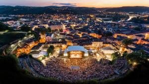 an aerial view of a crowd of people in a city at night at Studio de charme - Centre Vienne - Proche gare in Vienne
