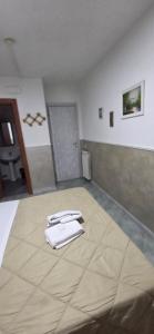 a room with two white towels on a bed at Hotel Alloggio Del Conte in Naples +73 photos