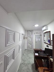 an empty room with a desk and a hallway at Hotel Alloggio Del Conte in Naples
