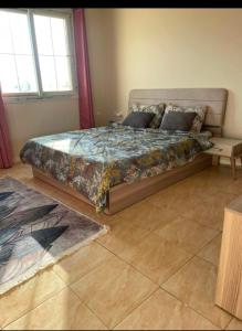 a bedroom with a large bed in a room at فيلا رامي رزق Luxury villa with private pool& complete privacy in 6th Of October
