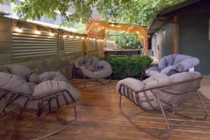 a patio with chairs and a table with lights at Zion Base 3BR Home Backyard Oasis Pets Welcome in St. George
