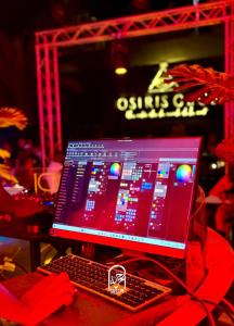 a computer monitor and a keyboard on a table at Disco tour Open Air Djerba in Djerba