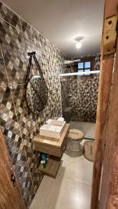 a bathroom with a sink and a mirror on the wall at Recanto HipoMar in Marechal Floriano