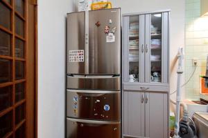 a large stainless steel refrigerator in a kitchen at Guest House Wa N Wa in Osaka