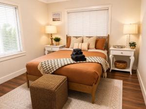 a bedroom with two beds and two windows at The Hangout House With Bonus Game Room & Foosball in Coeur d'Alene