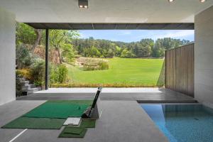 a house with a pool and a view of a yard at Haeundae Beach Restfield in Busan