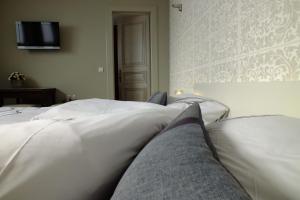 Letto o letti in una camera di B&B Sint Pieter