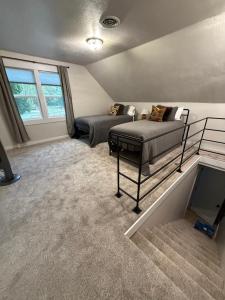 a bedroom with two beds and a tv in it at Home Town Mountain Lodging 2 in Darby