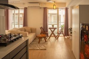 a living room with a couch and a table at Casa Lucia in Pune