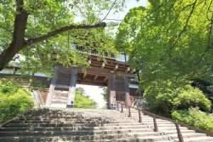 a set of stairs leading to a building at goemon-inn in Akita
