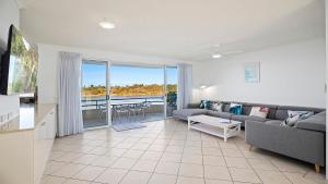 a living room with a couch and a table at Quayside in Nambucca Heads