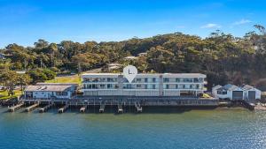 an aerial view of a large building on the water at Quayside in Nambucca Heads