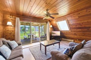 a living room with a couch and a ceiling fan at Chalet 71 in Stevensville