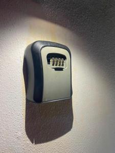 a black and white object attached to a wall at Departamento Patri in General Pico