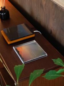 two tablet computers sitting on a wooden table at 一組限定の宿 季の間 Private Traditional House & Tea Experience in Nagano in Iida