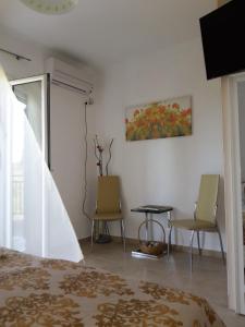 TV a/nebo společenská místnost v ubytování Rodon Apartments