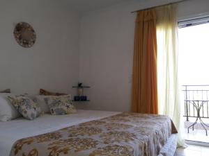 Postel nebo postele na pokoji v ubytování Rodon Apartments
