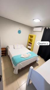 a bedroom with a bed in a room at Res Praia e Sol litoral do Pr Matinhos in Matinhos +24 photos