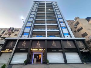 a tall building with the entrance to a restaurant at برج الهندي in Cairo
