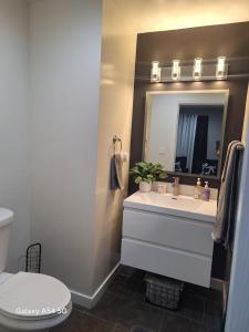a bathroom with a sink and a mirror at Beautiful studio in Azusa