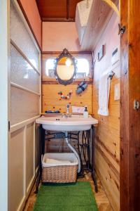 a bathroom with a sink and a mirror at The Sticks Inatori in Higashiizu +80 photos