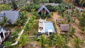 an aerial view of a house with a swimming pool at Green Luxe in Dambulla