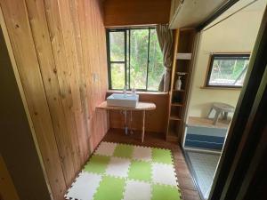 a small bathroom with a sink and a shower at Rulo Classic Garden in Shishikui