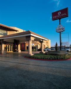 a first inn sign in front of a building at Fiesta Inn Saltillo in Saltillo