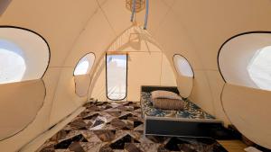 a small room with a bench in a tent at Guest House of Issyk-Kul Camp in Chok-Tal