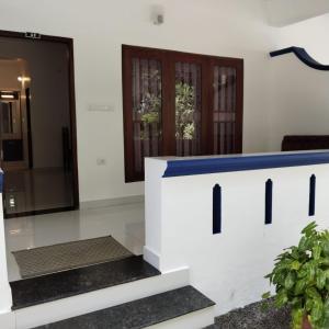 a view of the entrance to a house at Hotel Neptune Kovalam in Trivandrum