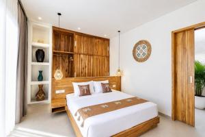 a bedroom with a large bed in a room at Santo Villa Uluwatu in Bingin Beach +21 photos