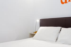 Posteľ alebo postele v izbe v ubytovaní Casa Cosi Sant Antoni
