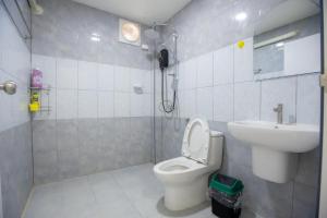 a bathroom with a toilet and a sink at First light beach hin kong in Hinkong +62 photos