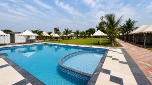 a pool at the resort at Unity Holiday Resort in Kevadia