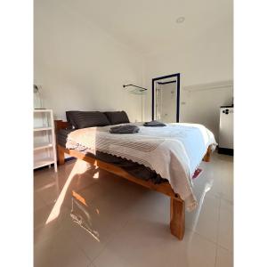 a bedroom with a bed in a room at Blue House Klong Hin in Ko Kood