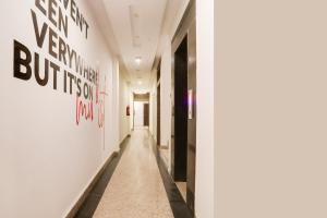 a corridor in a building with a hallway at Collection O Gol Park Atala in Prayagraj