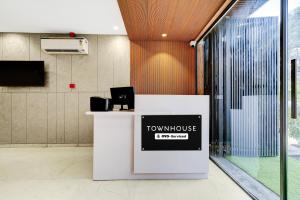 a counter with a townhouse sign on it in a room at Townhouse Sector 51 Gurgaon in Gurgaon