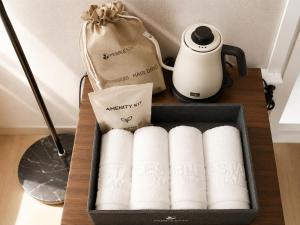 a box filled with a bunch of rolls of paper towels at 페블스테이 남포점 in Busan