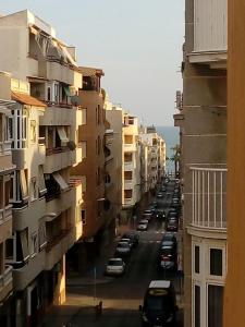 a view of a city street with parked cars at Studio Almudena in Torrevieja