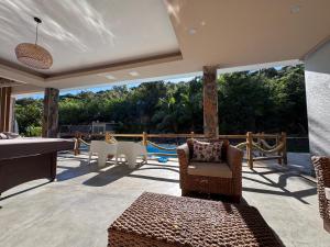 a patio with a pool table and a playground at La Cabane D Eté in Port Mathurin