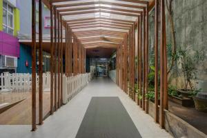 a hallway in a building with wooden beams at Hotel Bunga-Bunga By ARBA in Jakarta