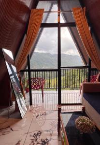 a view from a room with a large glass window at Tribez Valley Resort in Anaviratty