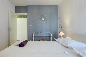 Posteľ alebo postele v izbe v ubytovaní Sea Rhapsody Apartment