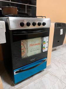 a stove with a sign on the front of it at Apartamento Patagonia in Puerto San Julián +18 photos
